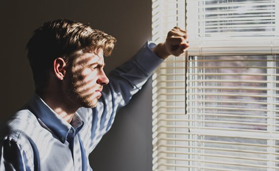 depression symptoms man staring out window